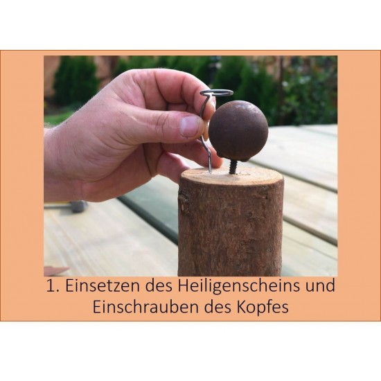 1. Einsetzen Heiligenschein und Einschrauben des Kopfes
