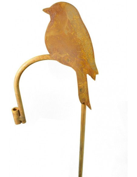 Deko rostiges Zaunelement mit sitzendem Vogel